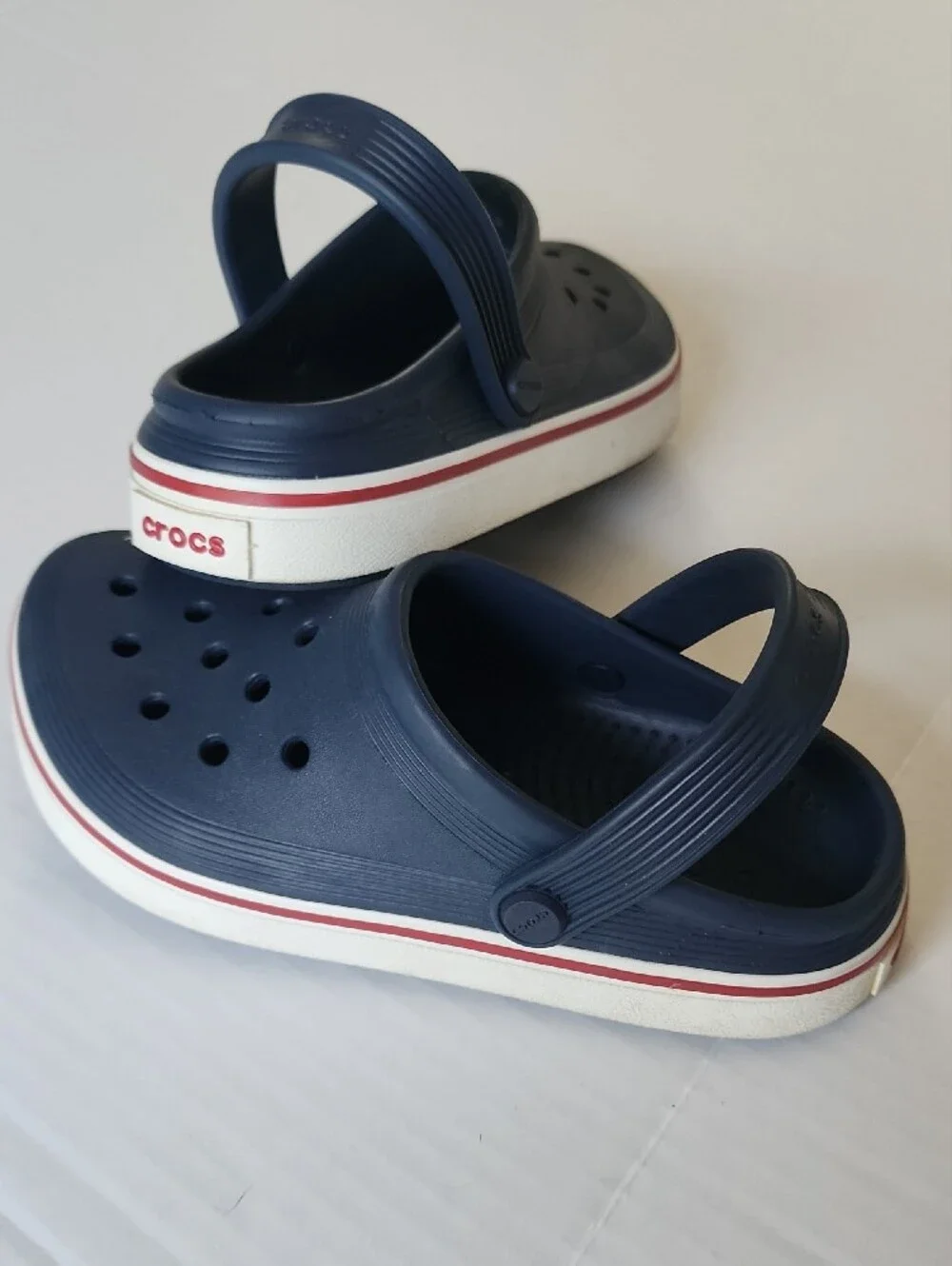 CROCS Kids Navy Clogs with Red and White Trim